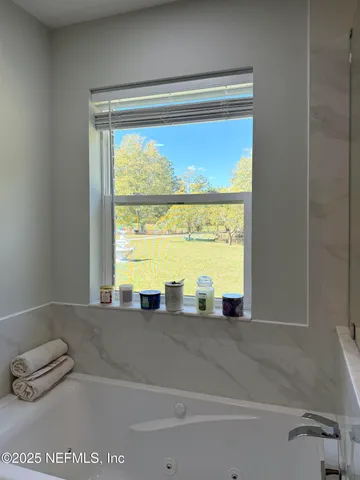 a view of swimming pool with a patio