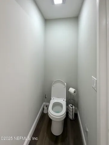 a view of a lake with a house in the background