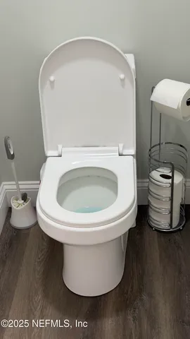 a view of a wooden deck with a lake