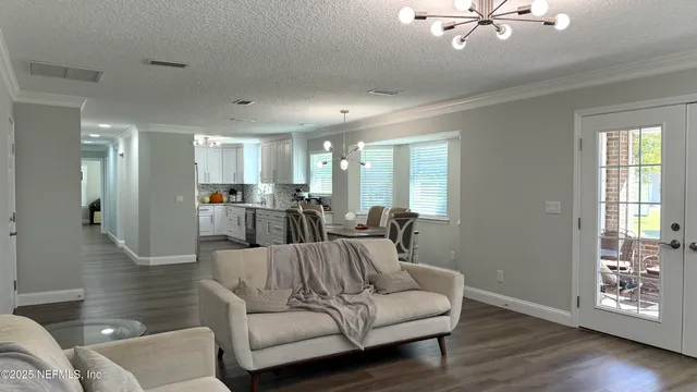 a kitchen with stainless steel appliances granite countertop a sink a stove and cabinets