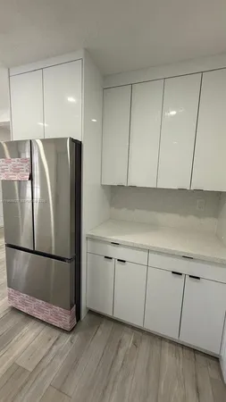 a kitchen with a stove and a microwave