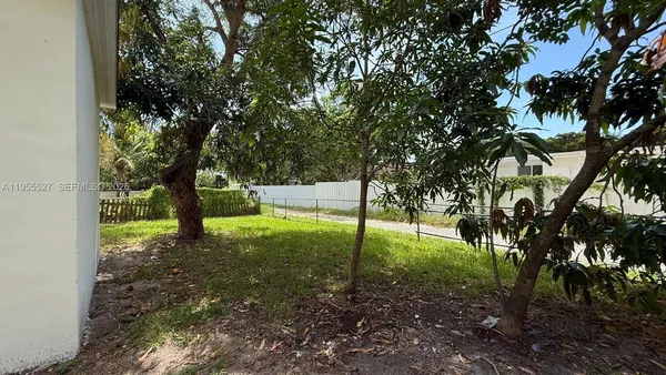 a house view with a backyard space