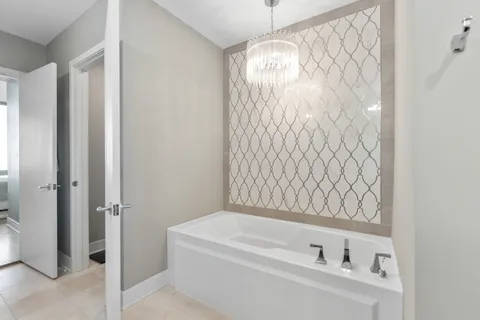 a bathroom with a bathtub and shower