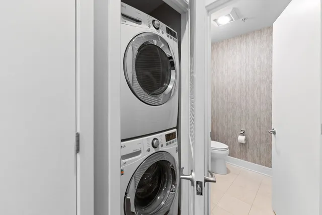 a view of a hallway with washer and dryer