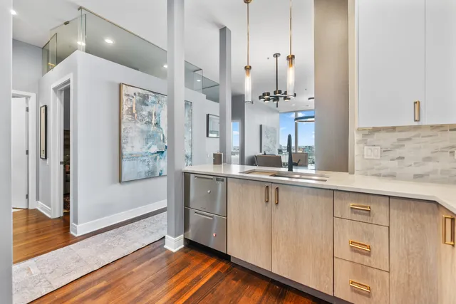 a spacious bathroom with double vanity sink and a mirror