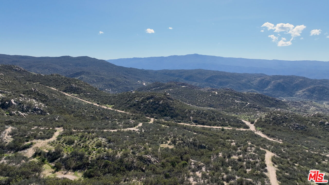 4 Sycamore Falls Road Aguanga, CA 92536 - Photo 22 of 67 a view of a house with a mountain