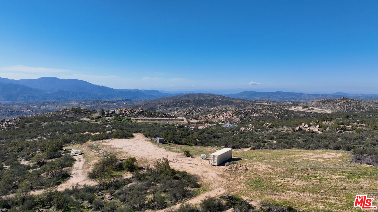 4 Sycamore Falls Road Aguanga, CA 92536 - Photo 25 of 67 a view of a lake with mountains in the background