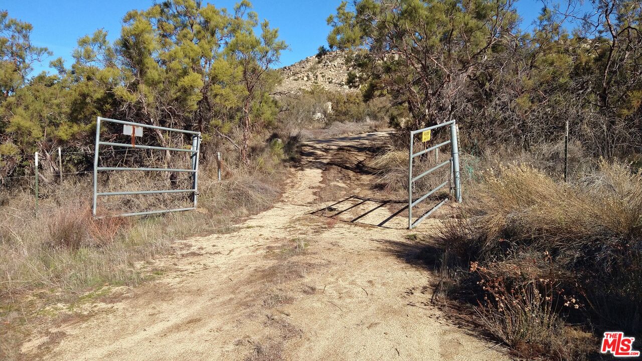 4 Sycamore Falls Road Aguanga, CA 92536 - Photo 33 of 67 a backyard of a house with lots of green space