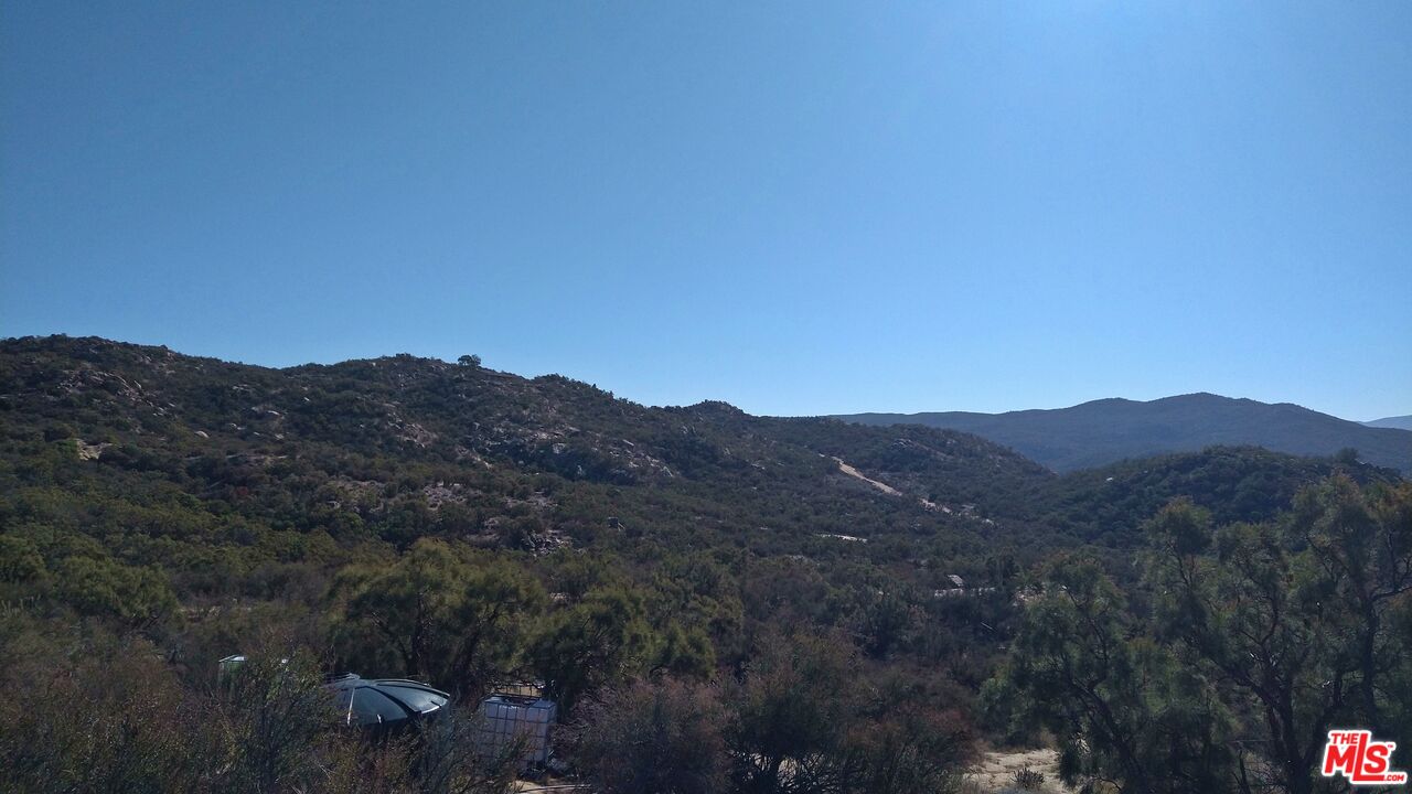 4 Sycamore Falls Road Aguanga, CA 92536 - Photo 49 of 67 a view of a mountain range with lush green forest