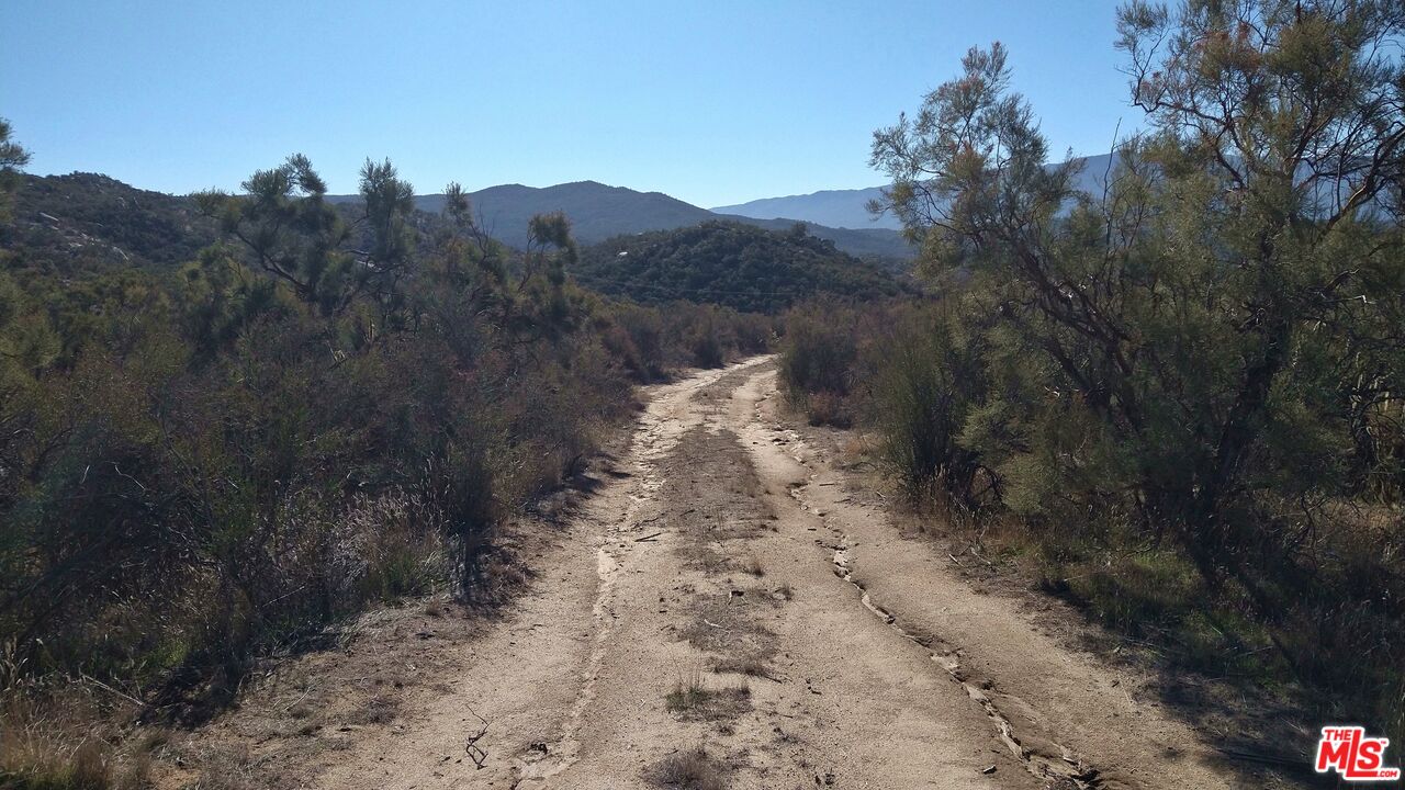 4 Sycamore Falls Road Aguanga, CA 92536 - Photo 55 of 67 a view of a road with a mountain in the background