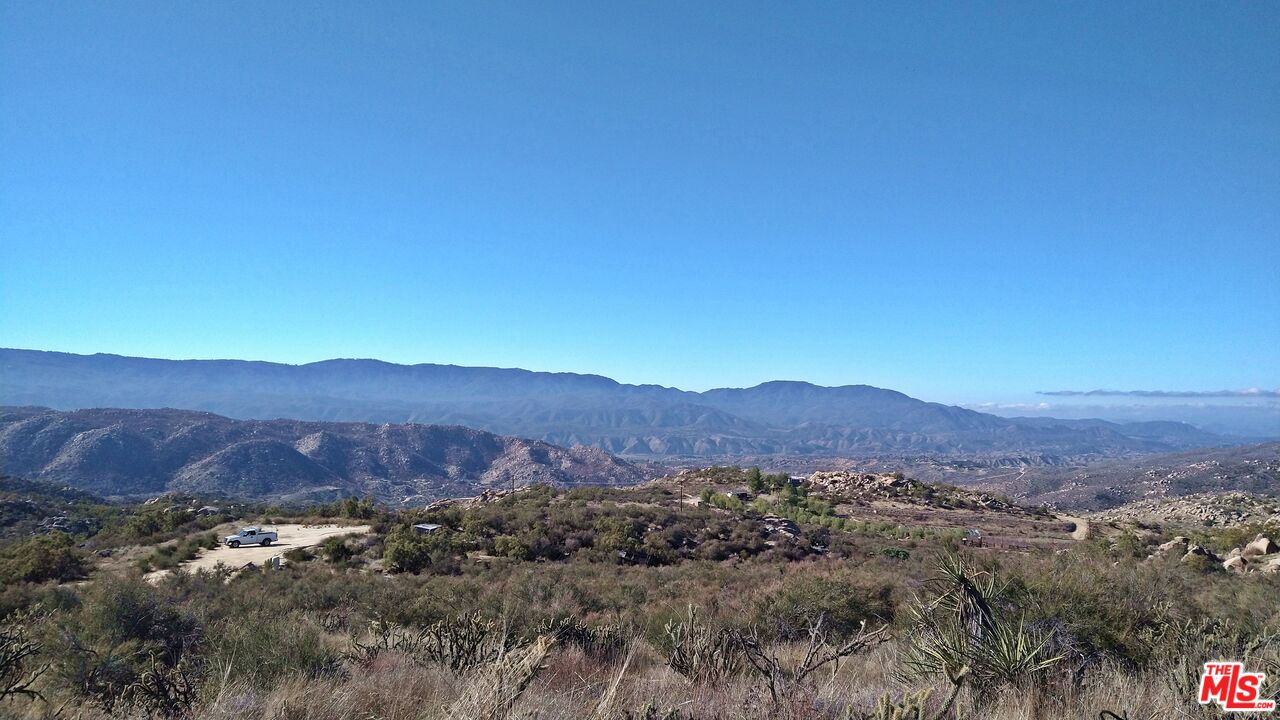 4 Sycamore Falls Road Aguanga, CA 92536 - Photo 61 of 67 a view of a lush green hillside and a houses