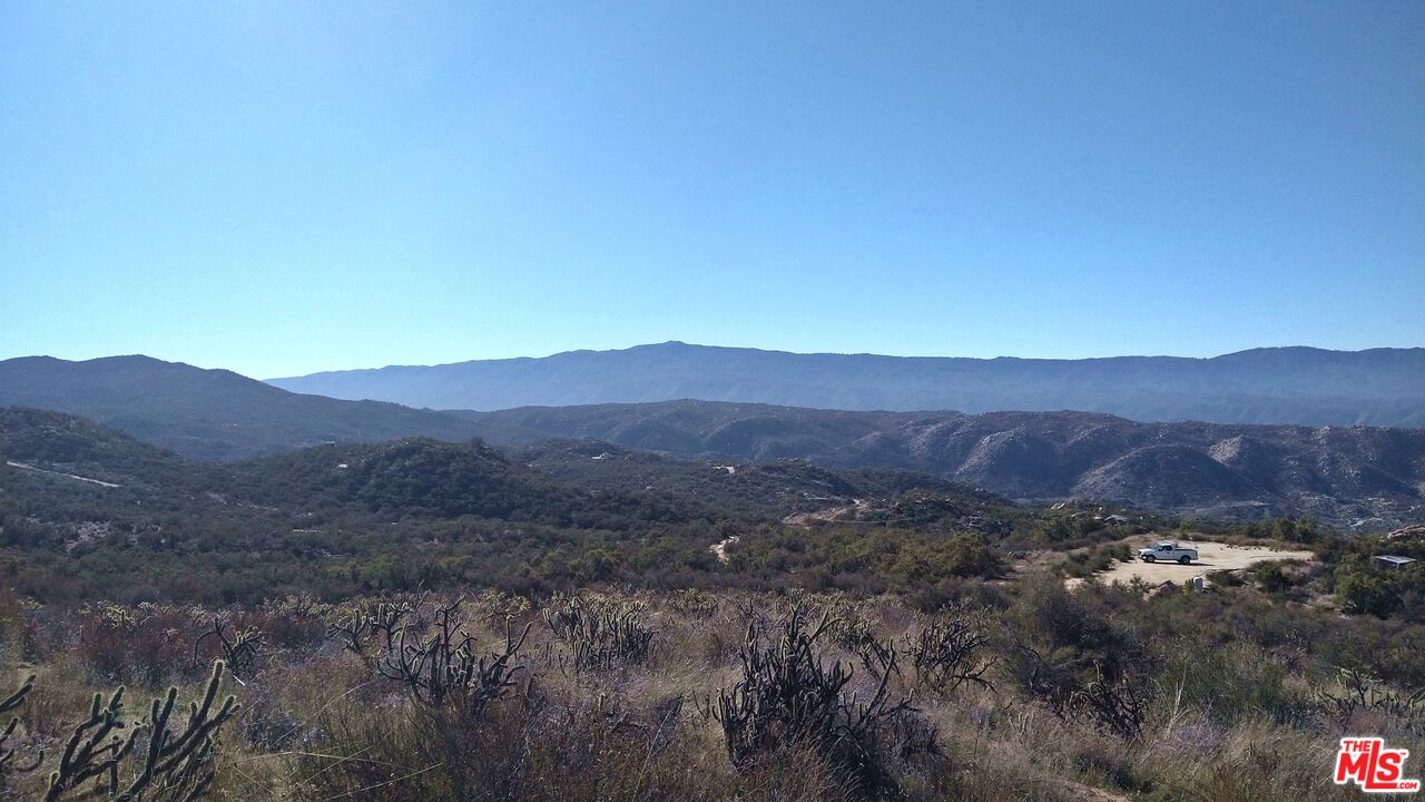 4 Sycamore Falls Road Aguanga, CA 92536 - Photo 62 of 67 a view of a lush green hillside and a mountain