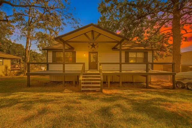 a view of a house with a street