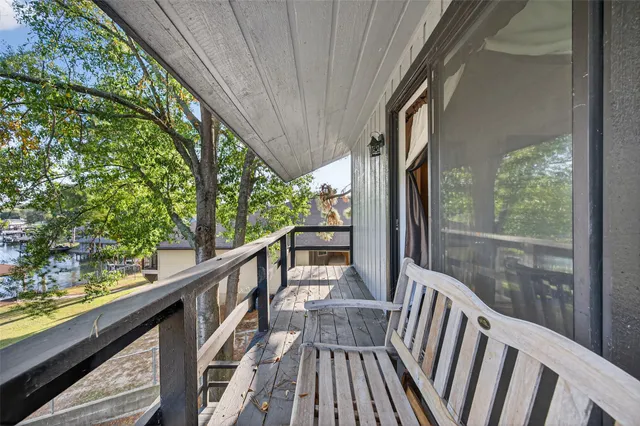 a bedroom with a bed and a television