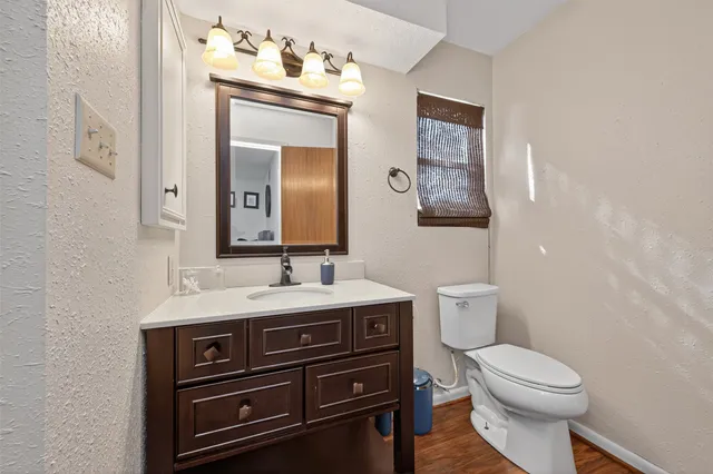 a view of a two chairs in the balcony next to a yard