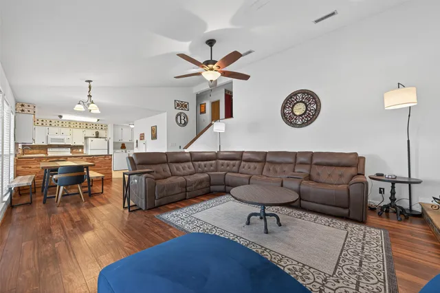 a living room with furniture and a table