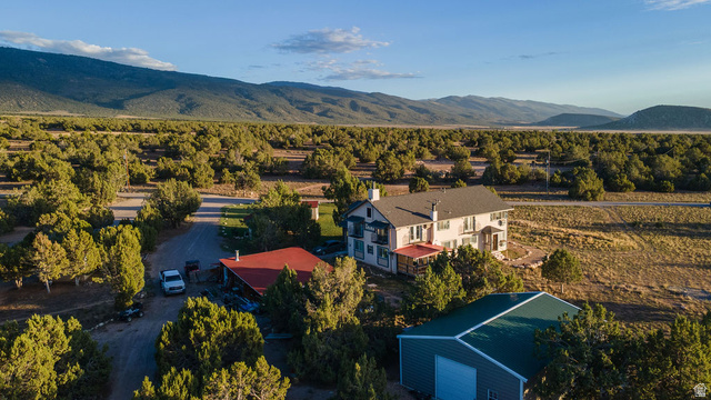 11550 Pigeon Hollow Road Spring City, UT 84662 - Photo 11 of 85 Two-story residence with a light-colored exterior and multiple chimneys