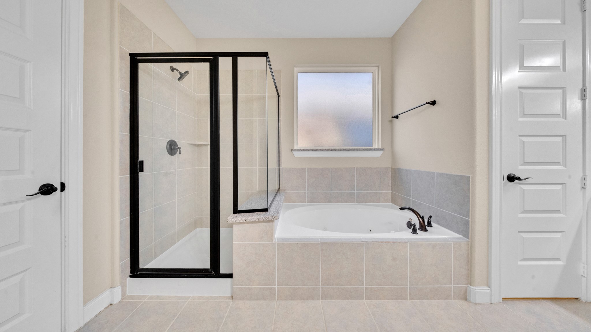 18118 Berry Garden Lane Spring, TX 77379 - Photo 20 of 45 Relaxing soaking tub paired with a spacious walk-in shower and privacy window.