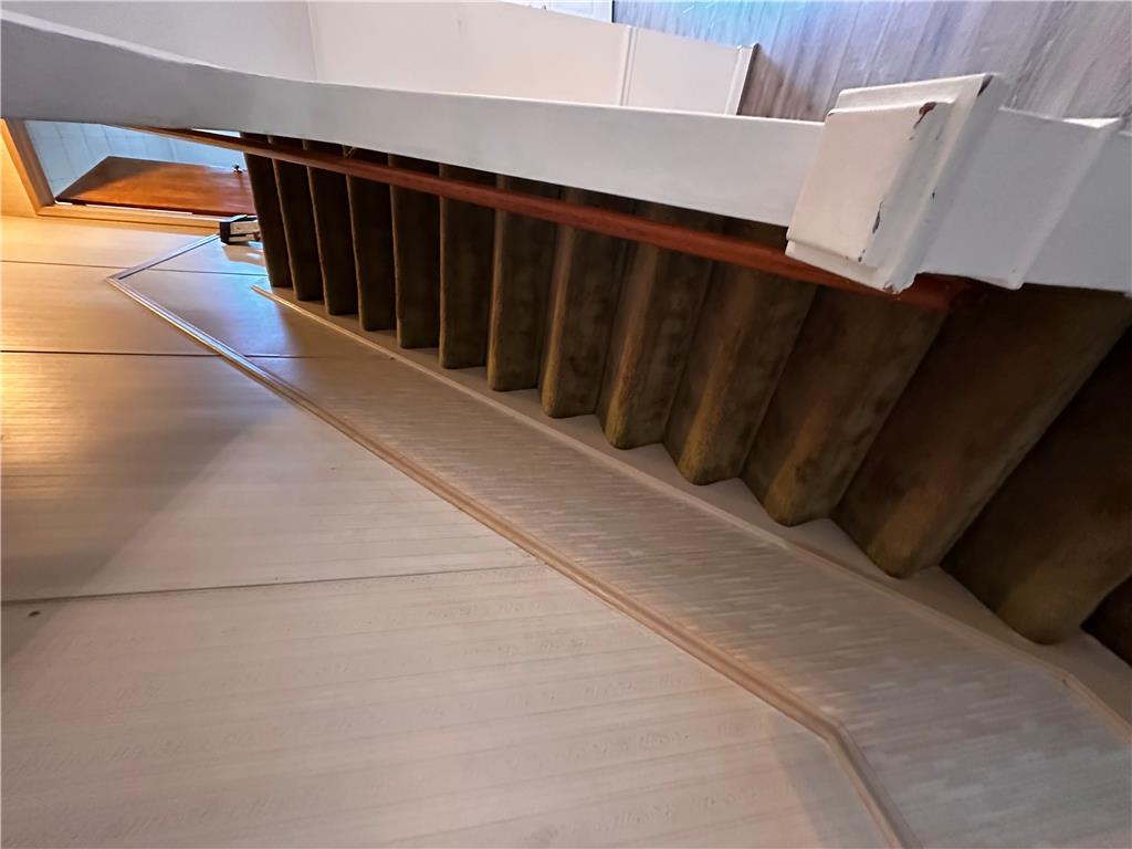 5128 3rd Street Whitehall, PA 18052 - Photo 19 of 26 Elegant wooden banister with a refined railing adds a touch of classic charm to this staircase.