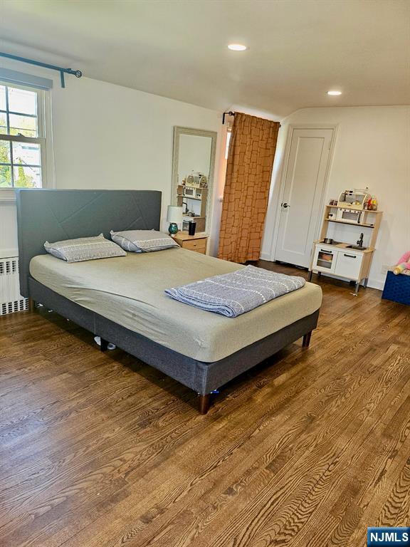 440 Bogert Road River Edge, NJ 07661 - Photo 21 of 25 a spacious bedroom with a bed and wooden floor