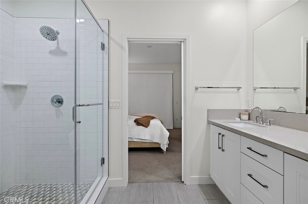 769 Doheny Way Dana Point, CA 92629 - Photo 24 of 35 a en suite bathroom with a sink and mirror