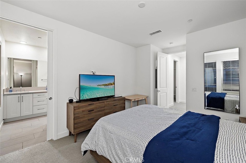 769 Doheny Way Dana Point, CA 92629 - Photo 26 of 35 a bedroom with a bed and a television in it