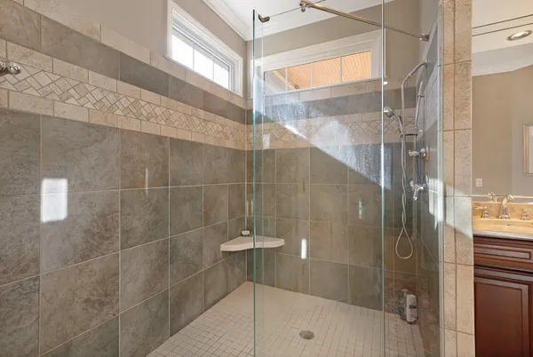 a bathroom with a toilet a sink and a shower