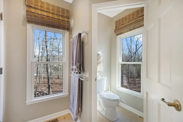 a bedroom with a bed and a chair