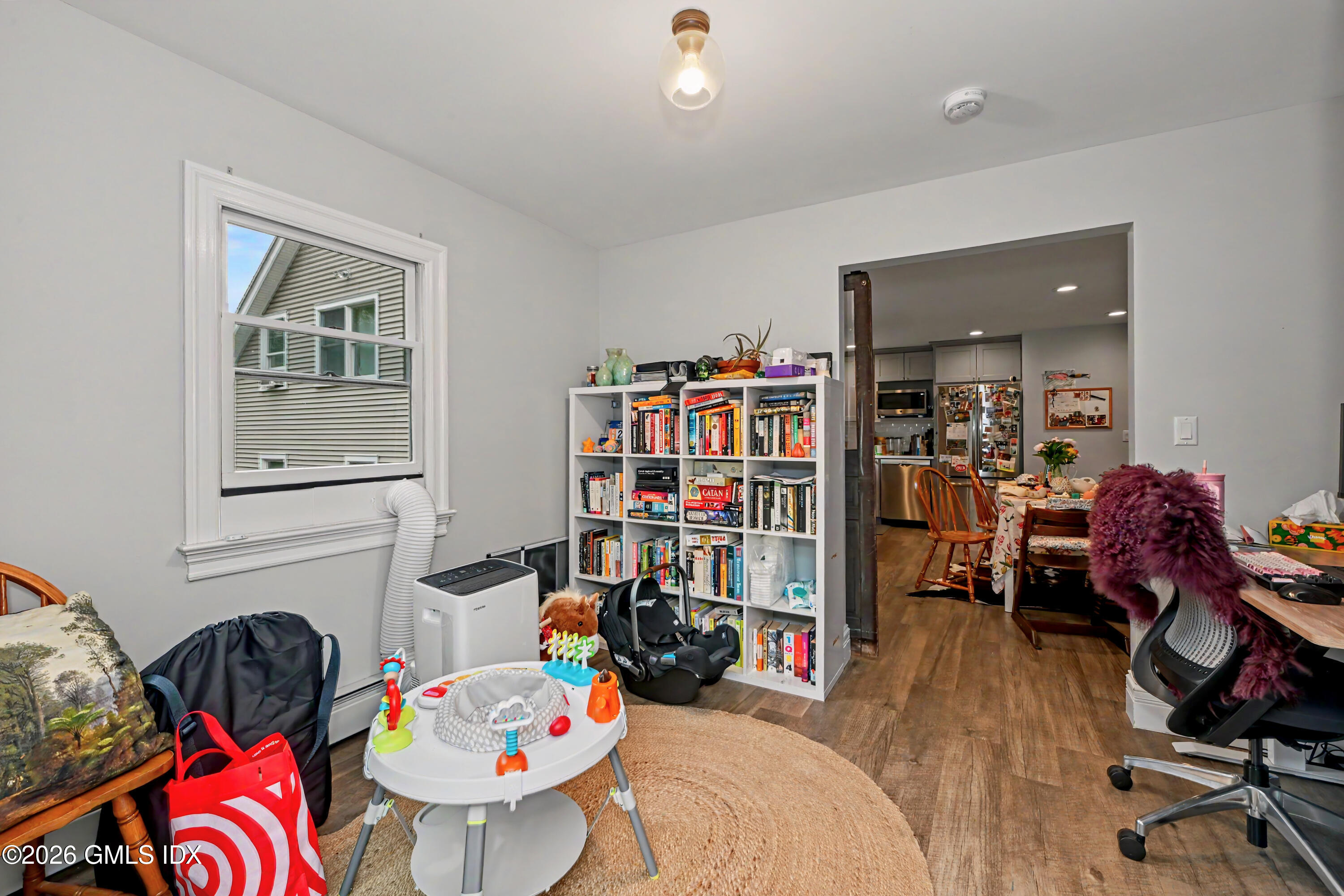 37 Prospect Street Greenwich, CT 06830 - Photo 22 of 41 a living room filled with furniture and a book shelf