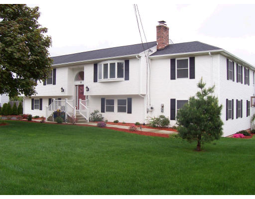82 Country View Street West Springfield, MA 01089 - Photo 1 of 13 a front view of a house with a garden