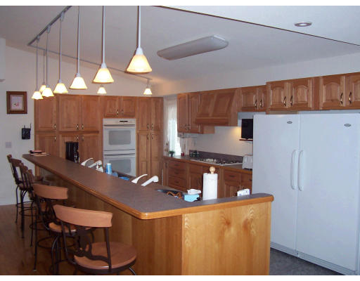 82 Country View Street West Springfield, MA 01089 - Photo 3 of 13 a kitchen with a dining table and chairs