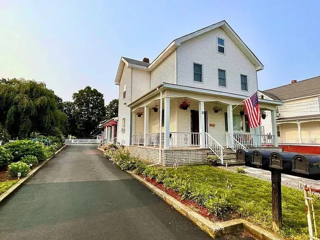 a front view of a house with garden