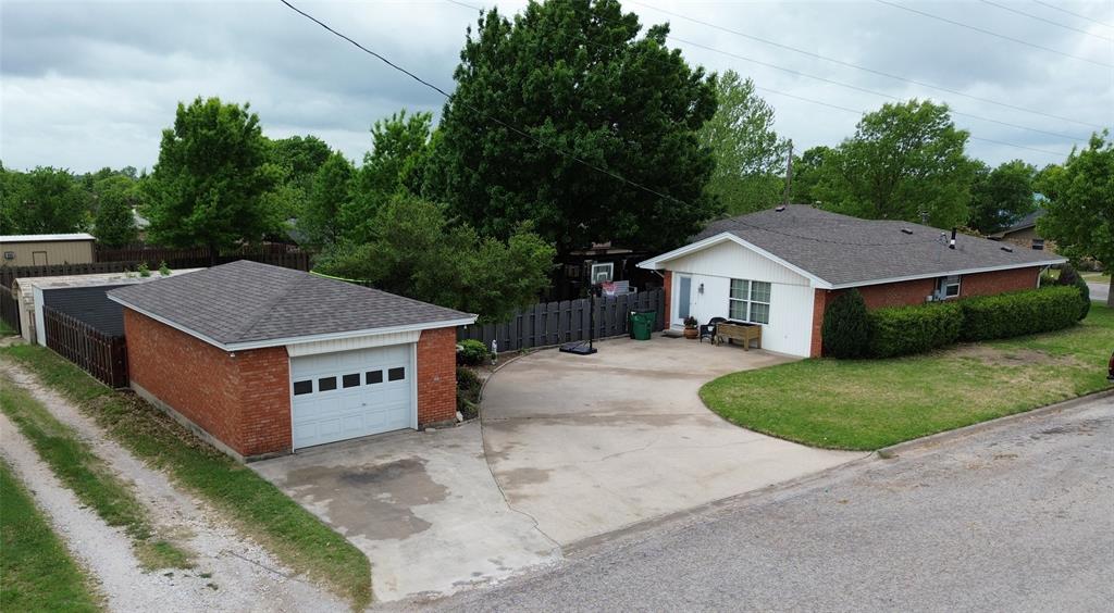 934 North Maple Street Muenster, TX 76252 - Photo 33 of 39 a house with trees in front of it