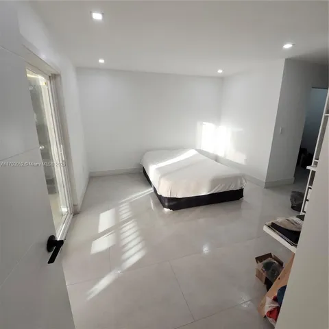 a view of hallway with stairs and a couch