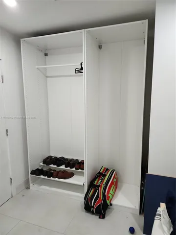 a view of room with furniture and flat screen tv