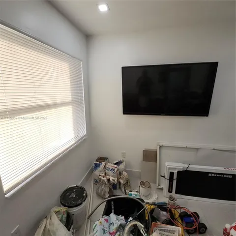 a front view of a house with parking space