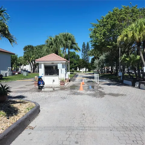 a view of a park that has large trees