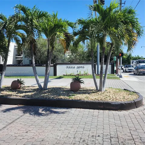 a view of a street with a building in the background