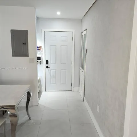 a view of a hallway with closet