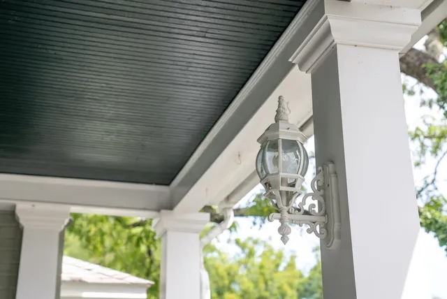 a bathroom with a sink a mirror and wooden floor
