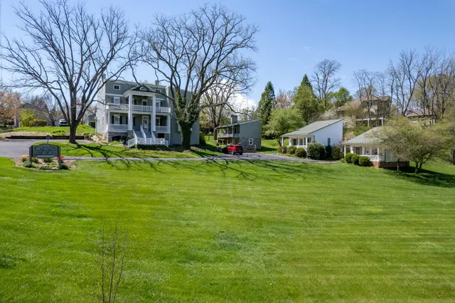 a view of a house with a big yard