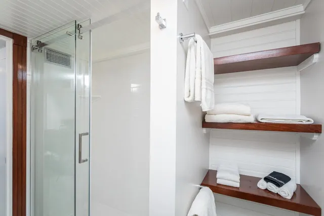 a bath room with a bath tub and a toilet