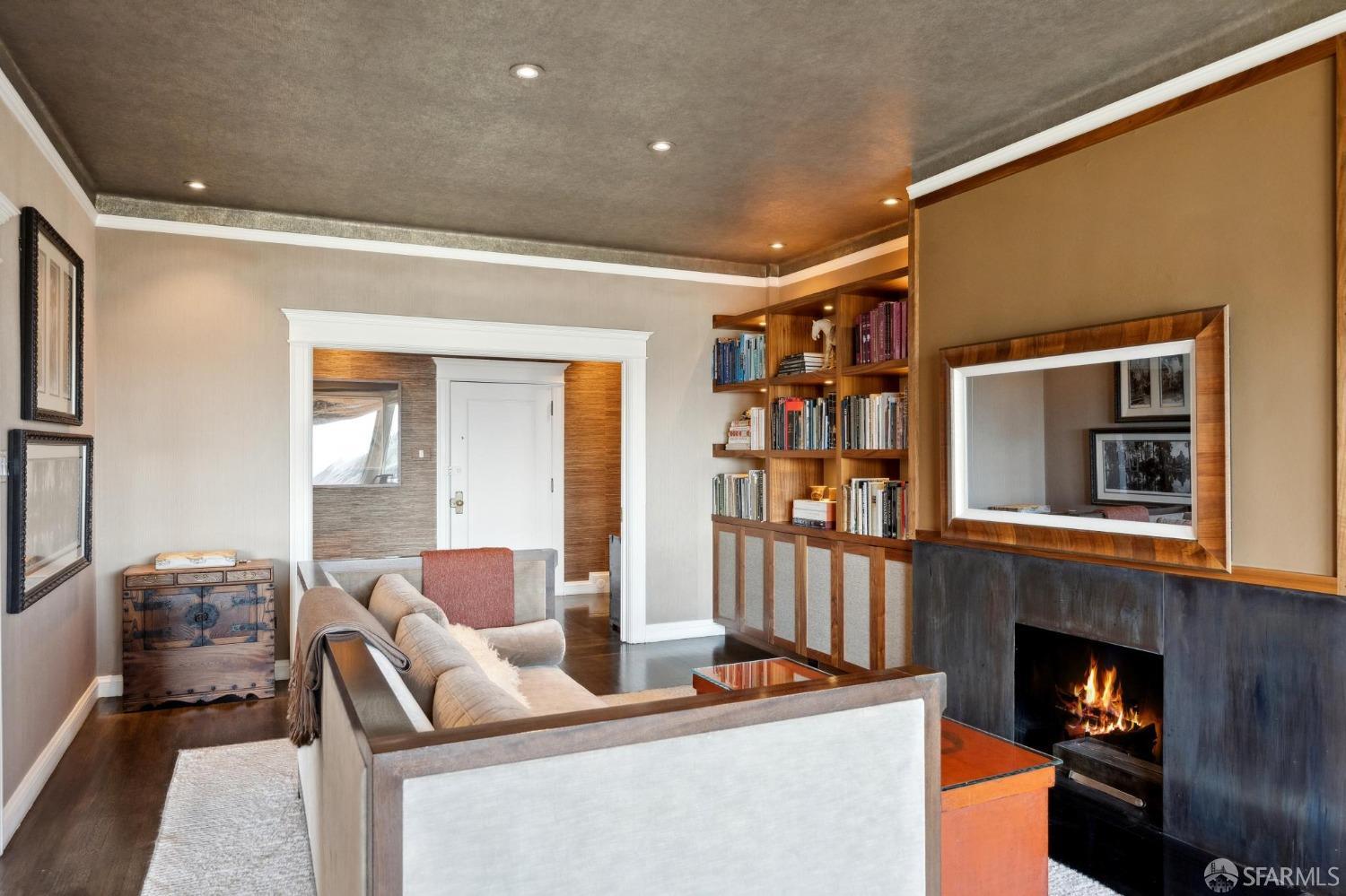 2111 Hyde Street, Unit 403 San Francisco, CA 94109 - Photo 16 of 60 a living room with fireplace furniture and a flat screen tv