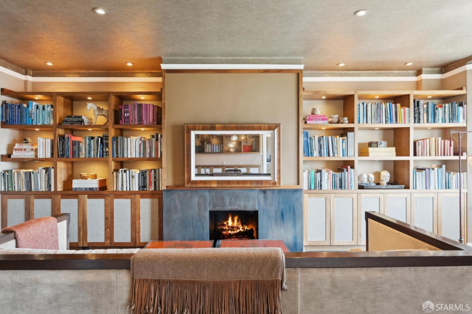 2111 Hyde Street, Unit 403 San Francisco, CA 94109 - Photo 17 of 60 a living room with furniture and a book shelf