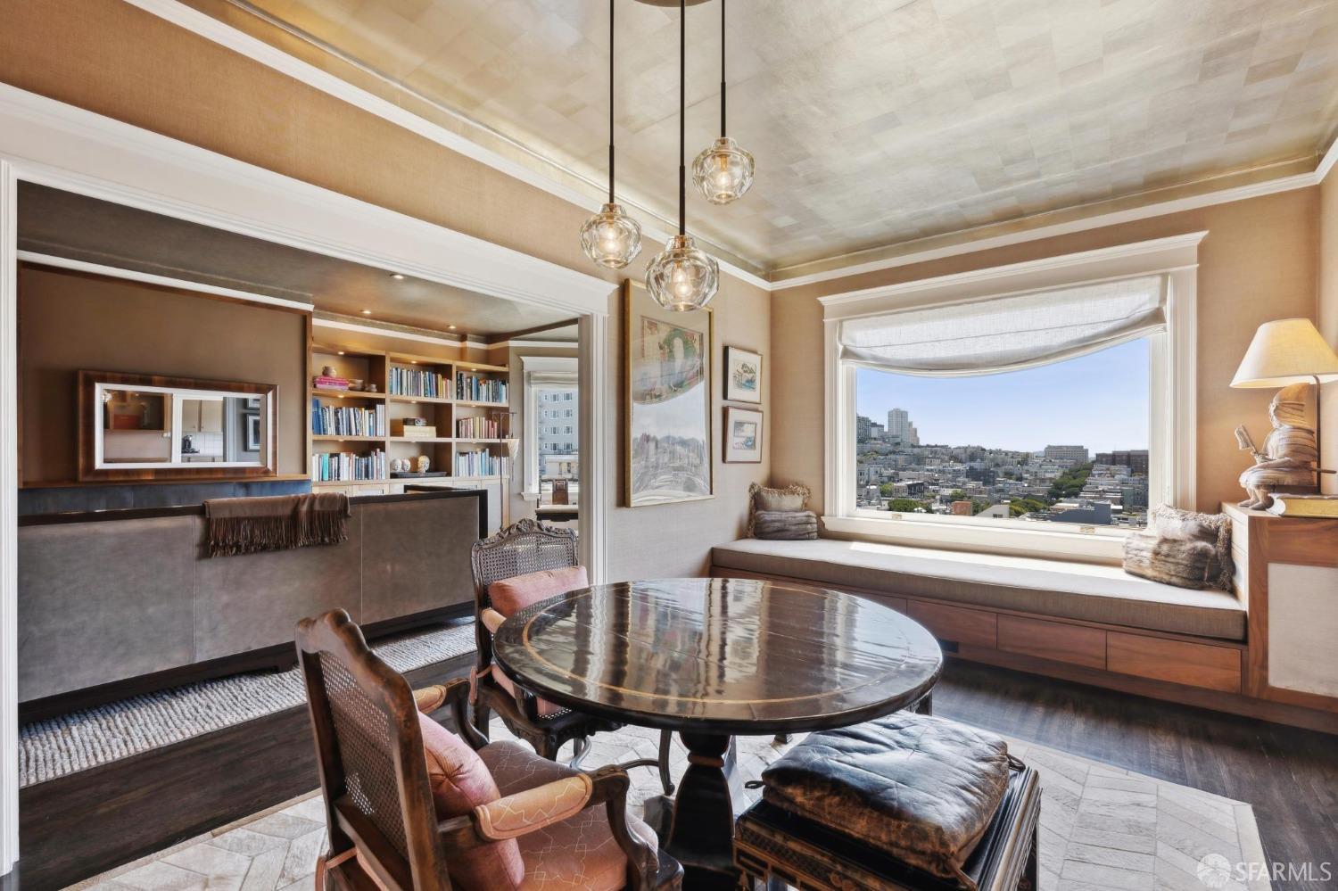 2111 Hyde Street, Unit 403 San Francisco, CA 94109 - Photo 18 of 60 a dining room with furniture and a floor to ceiling window