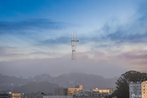 a kitchen with kitchen island a window and a refrigerator