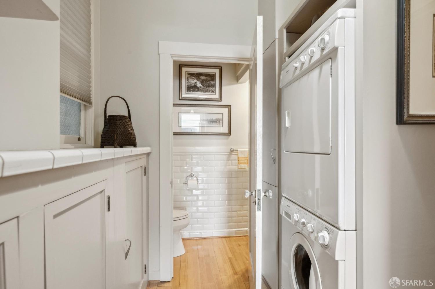 2111 Hyde Street, Unit 403 San Francisco, CA 94109 - Photo 30 of 60 a close view of a sink and a washer dryer