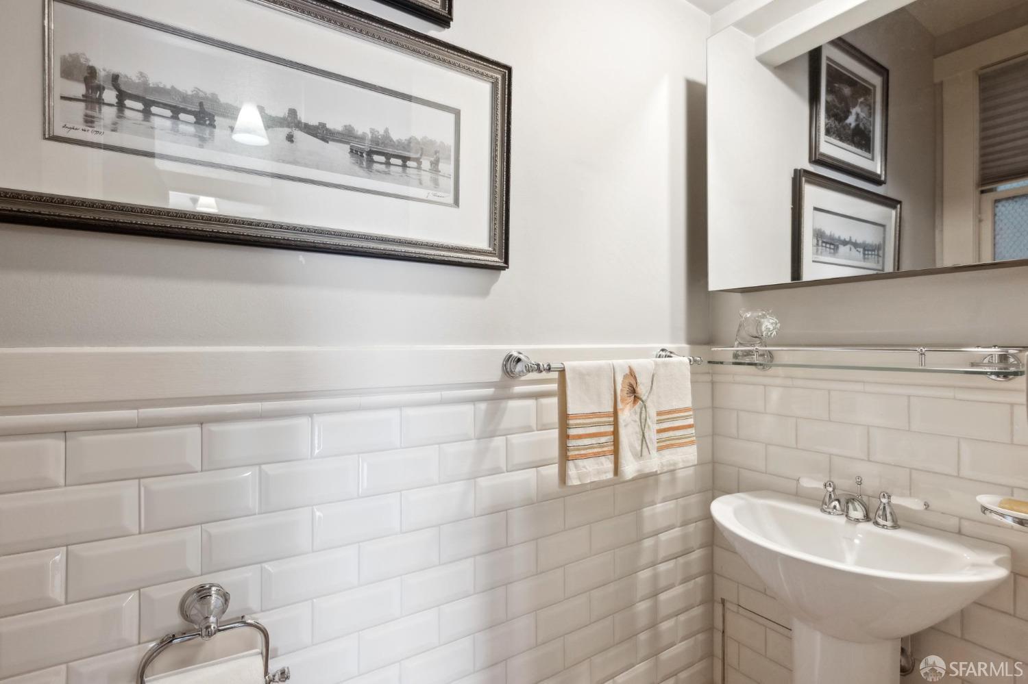 2111 Hyde Street, Unit 403 San Francisco, CA 94109 - Photo 31 of 60 a bathroom with a sink and a mirror