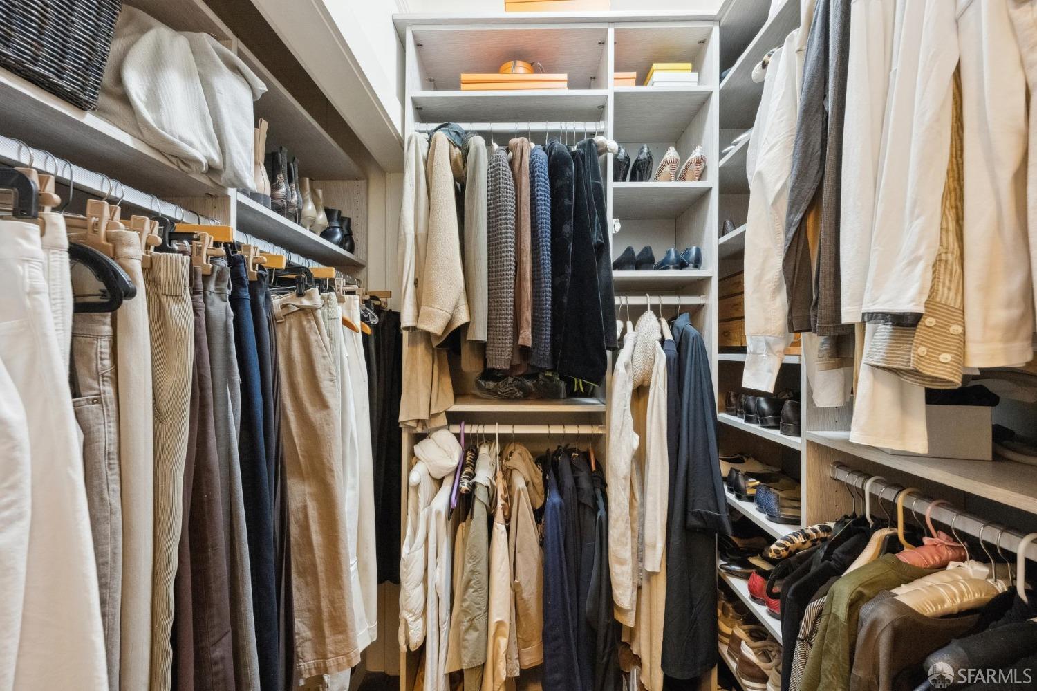 2111 Hyde Street, Unit 403 San Francisco, CA 94109 - Photo 33 of 60 a view of walk in closet with clothes and shoes