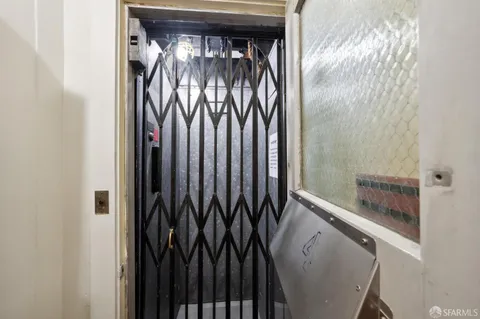 a view of hallway with wooden floor